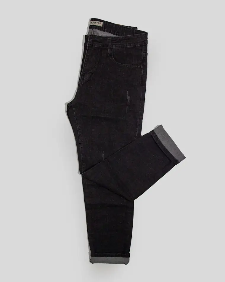 Folded dark tailored trousers